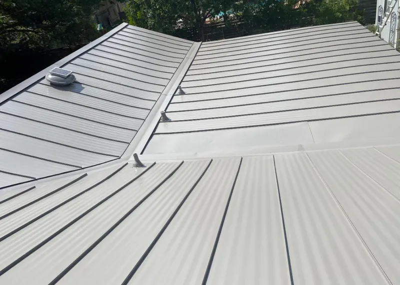 Solar attic fan installed on a metal roof for Roof Ventilation in Davis